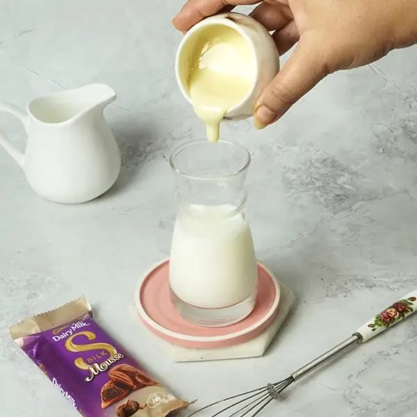 Dairy Milk Silk Tres Leches Cake-Take whole milk in a glass or bowl