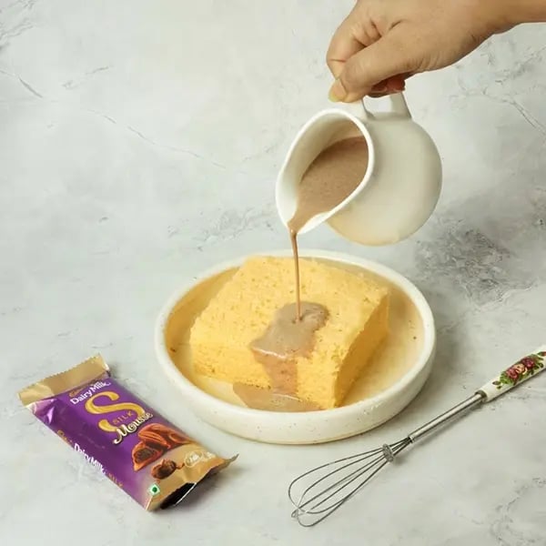 Dairy Milk Silk Tres Leches Cake-Pour the whole chocolate milk mixture