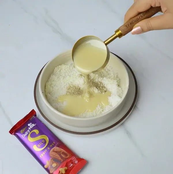 Dairy Milk Silk Two-in-One Coconut Laddoo - Add condensed milk