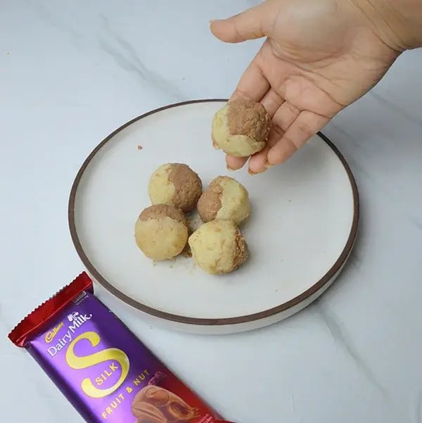 Dairy Milk Silk Two-in-One Coconut Laddoo - Roll them into ball shapes