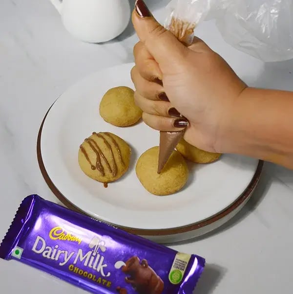 Dairy Milk Stuffed Chocolate Shortbread Cookies - Top with melted Dairy Milk chocolate