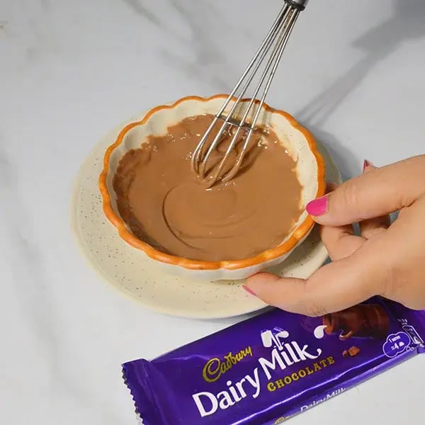 Dairy Milk Thandai Mousse With Cashew Crunch - Beat melted chocolate