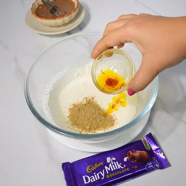 Dairy Milk Thandai Mousse With Cashew Crunch - Soak saffron