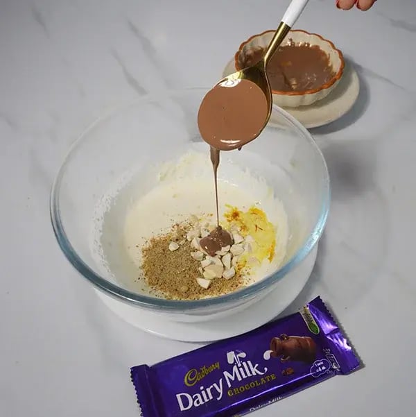 Dairy Milk Thandai Mousse With Cashew Crunch - Fold in melted chocolate