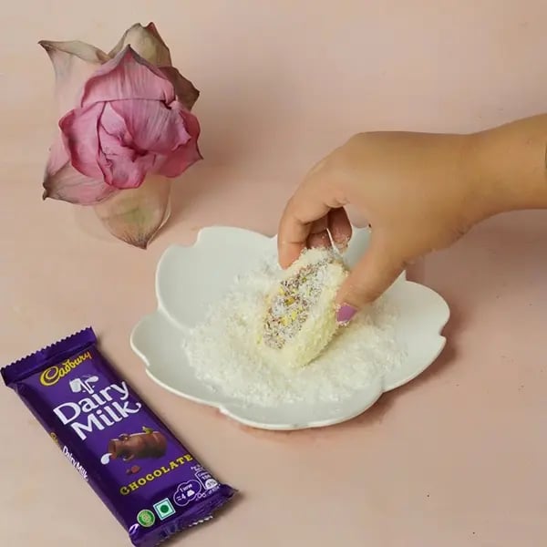 Dairy Milk Two-in-One Chomchom for Kali Puja-Lastly roll the chomchom in desiccated coconut