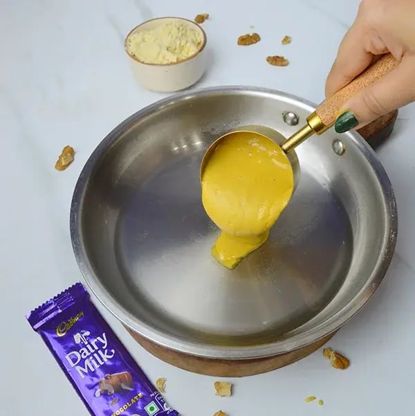 Dairy Milk Walnuts Infused Besan Barfi - Add the besan mixture