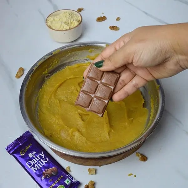 Dairy Milk Walnuts Infused Besan Barfi - Add Dairy Milk chocolate