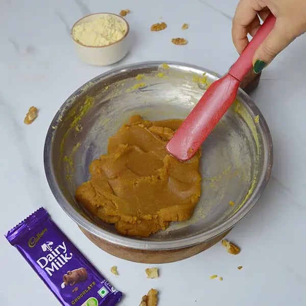 Dairy Milk Walnuts Infused Besan Barfi - Stir continuously