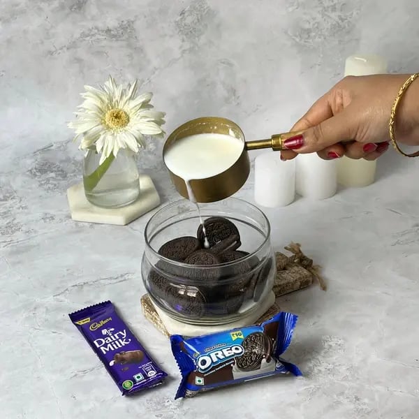 Dairymilk Oreo Biscuits Cake - Pour the milk over the cookies