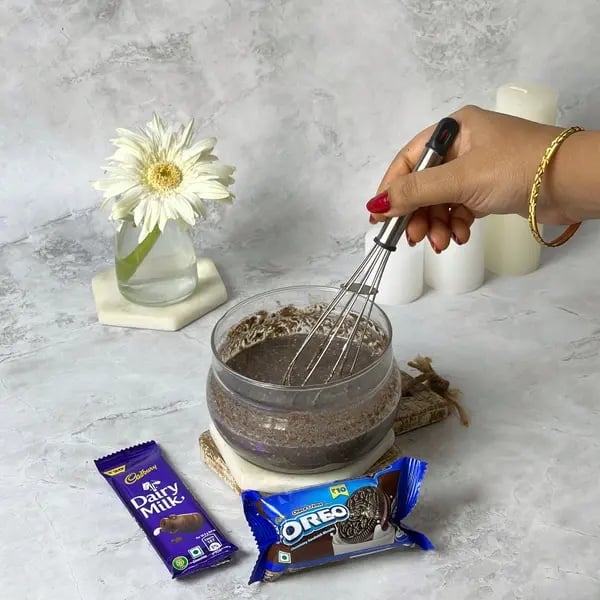 Dairymilk Oreo Biscuits Cake - Mash the softened cookies