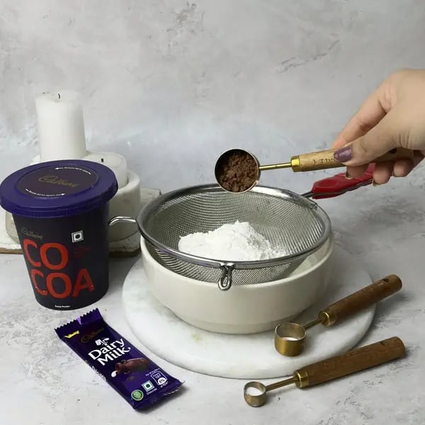 Dairymilk Sheet Cake - Sifting Dry Ingredients