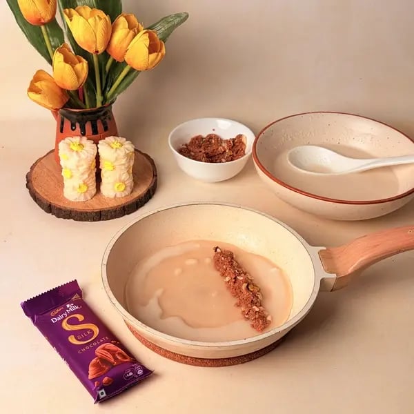 Diwali Special Bengali Patishapta Recipe With Cadbury Dairy Milk Silk And Mawa Filling - Adding Filling To Crepe
