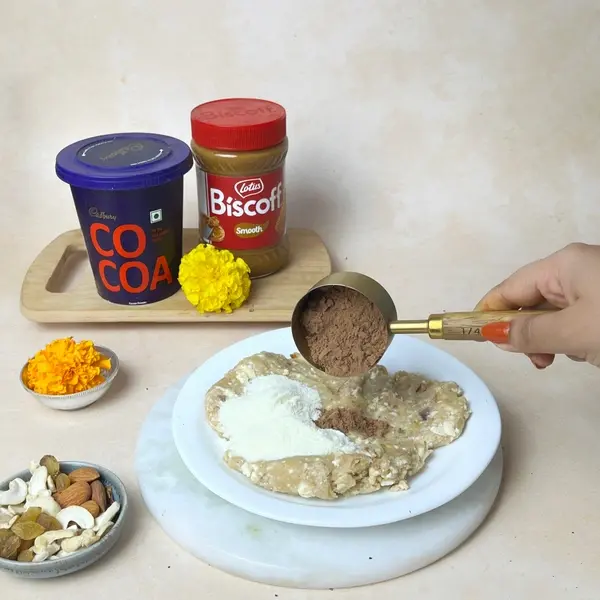 Diwali Special Pinni Recipe With Biscoff And Cadbury Cocoa Powder - Adding Sugar Cocoa
