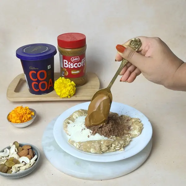 Diwali Special Pinni Recipe With Biscoff And Cadbury Cocoa Powder - Mixing Biscoff Spread