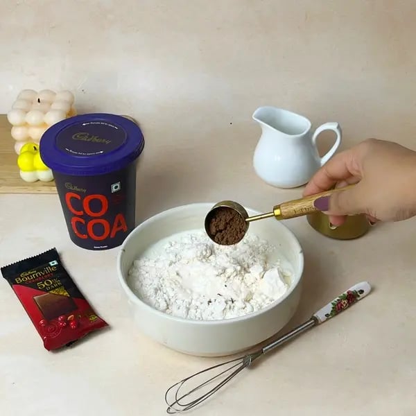 Easiest Bournville Mirror Glaze Cake - Adding Cocoa Powder