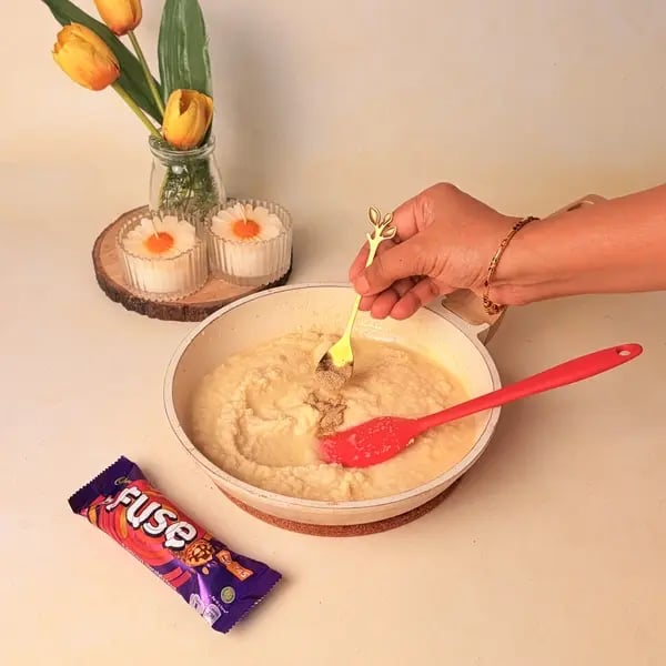 Easy Festive Special Rava Laddu With Cadbury Fuse To Celebrate Navratri - Mixing Cardamom Powder