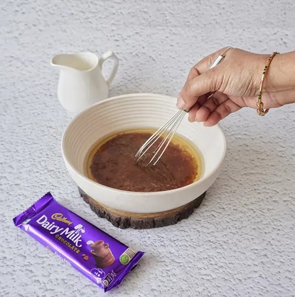 Eggless Avocado Muffins with Dairy Milk Chocolate-In a large bowl beat together brown sugar