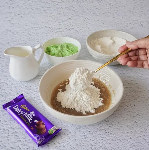 Eggless Avocado Muffins with Dairy Milk Chocolate-Gradually add the dry ingredients to the wet ingredients