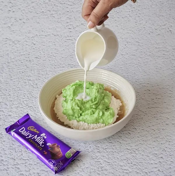 Eggless Avocado Muffins with Dairy Milk Chocolate-Add the milk and stir to incorporate