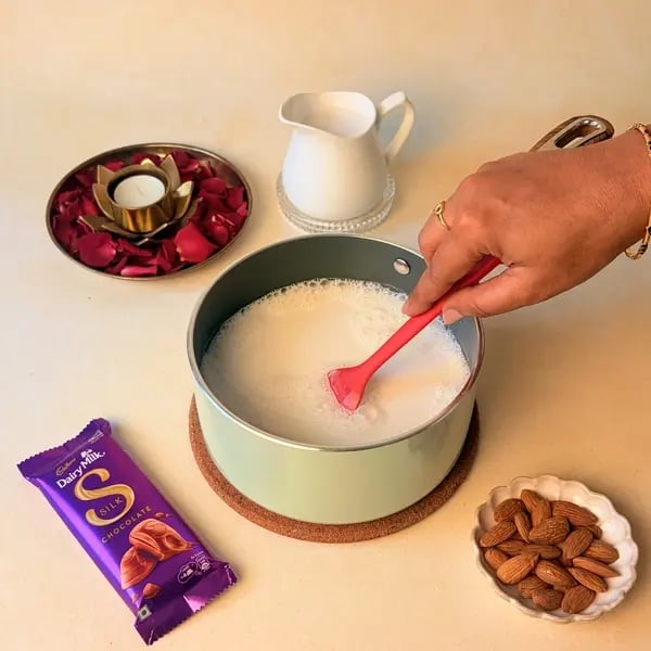 Elaneer Payasam With Cadbury Dairy Milk Silk Chocolate For Onam - Simmering Milk In Pan