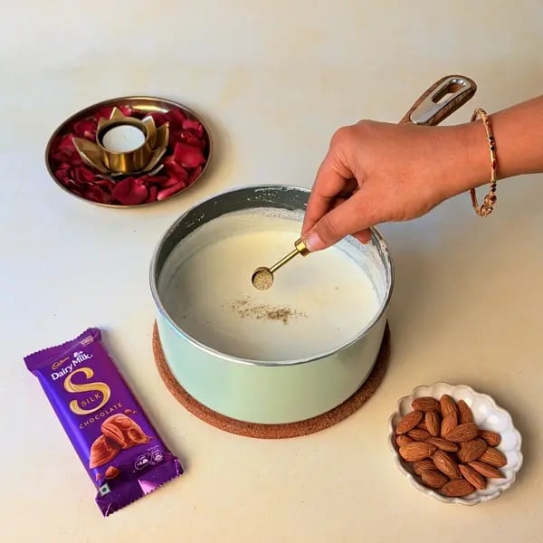 Elaneer Payasam With Cadbury Dairy Milk Silk Chocolate For Onam - Stirring Cardamom Powder