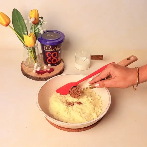 Festive Special Chocolate Mawa Jalebi Recipe With Cadbury Cocoa Powder, Rose And Pistachio Topping - Mixing Cocoa Powder