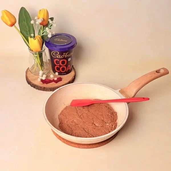 Festive Special Chocolate Mawa Jalebi Recipe With Cadbury Cocoa Powder, Rose And Pistachio Topping - Stirring Chocolate Mixture