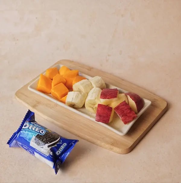 Frozen Bournville Chocolate Fruit Bites with Oreo Dust-Wash and cut the fruit