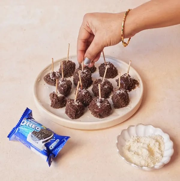 Frozen Bournville Chocolate Fruit Bites with Oreo Dust-Place the coated fruit pieces
