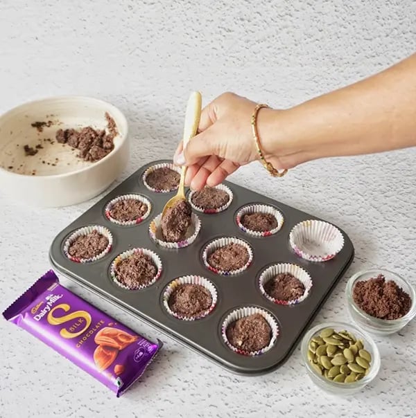 Frozen Silk Chocolate Bites with Nuts and Oreo Crumble - Line a mini muffin tray