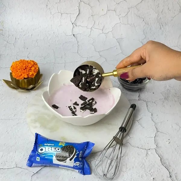 Ganpati Special: Oreo Blueberry Shrikhand Recipe To Try - Folding Crushed Oreos
