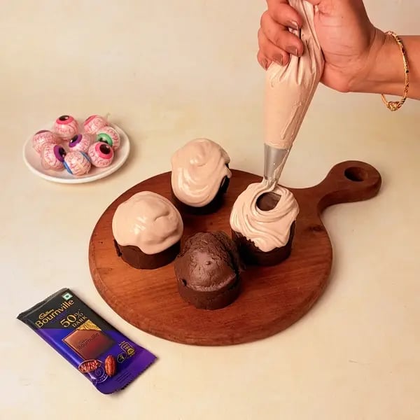 Gummy Eyeball Chocolate Cupcakes With Cadbury Bournville: An Easy Halloween Treat - Piping Chocolate Frosting