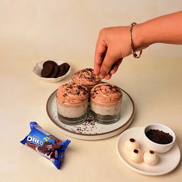 Halloween-Themed Cheesecake - An Oreo-Crusted Black Cocoa Dessert - Sprinkling Oreo Crumbs