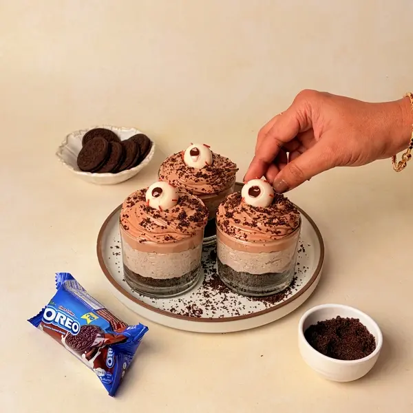 Halloween-Themed Cheesecake - An Oreo-Crusted Black Cocoa Dessert - Gummy Eyeballs Sprinkles