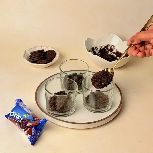 Halloween-Themed Cheesecake - An Oreo-Crusted Black Cocoa Dessert - Pressing Oreo Crust