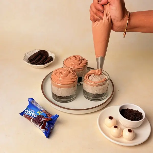 Halloween-Themed Cheesecake - An Oreo-Crusted Black Cocoa Dessert - Piping Chocolate Cream