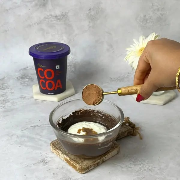 Cocoa Eggless Airfryer Nut Brownie - Adding Cocoa Powder