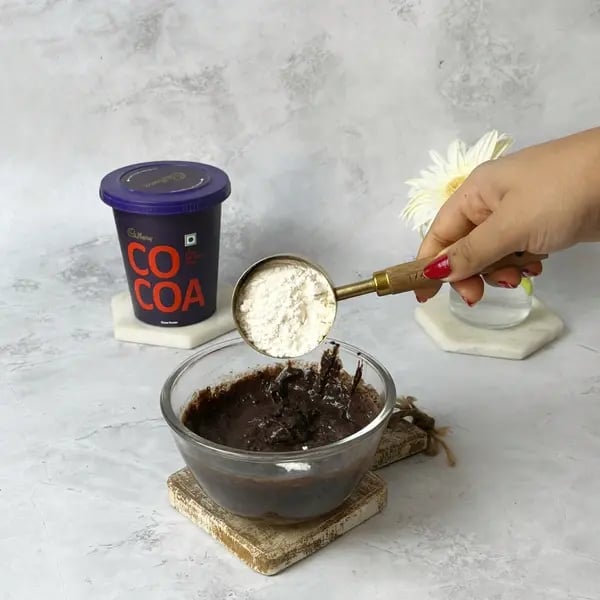 Cocoa Eggless Airfryer Nut Brownie - Adding Flour To Bowl