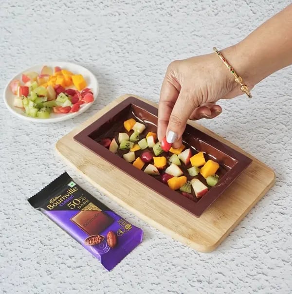 Healthy & Chocolatey Fruit Salad Bars with Bournville Chocolate - Distribute the chopped fruits