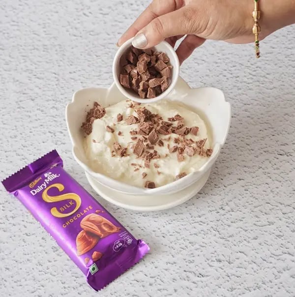 Healthy Cheesecake with Dairy Milk Silk and Mixed Nuts - Mix in some chopped pieces of Cadbury Dairy Milk Silk chocolate
