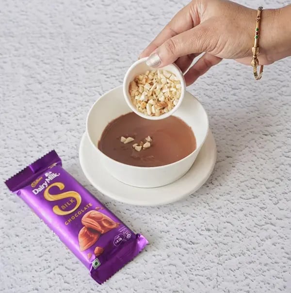 Healthy Cheesecake with Dairy Milk Silk and Mixed Nuts - Stir in a handful of chopped nuts
