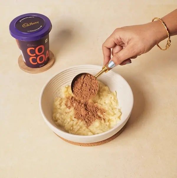 Healthy Choco Coconut Truffles With Banana For Friendship Day Gift - Add Cadbury Cocoa Powder to the mashed bananas