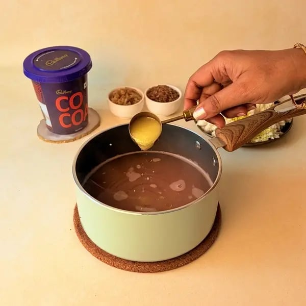How To Make Aravana Payasam For Onam: A Traditional Kerala Festive Dessert - Mixing Rice And Ghee