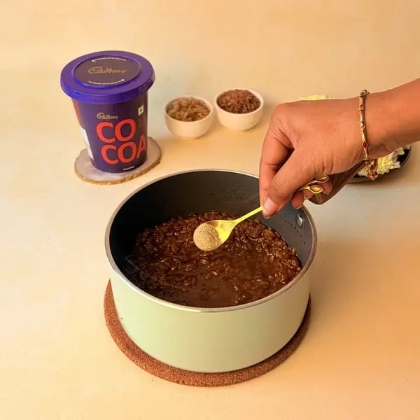 How To Make Aravana Payasam For Onam: A Traditional Kerala Festive Dessert - Adding Cardamom Powder