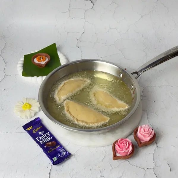 Karanji Recipe With Dairy Milk-Stuffed Mawa: A Rich Diwali Sweet With A Gooey Center - Garnished Karanji Cooling