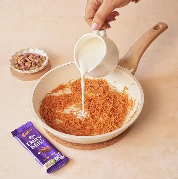 Kunafa Chocolate Dates with Cadbury Dairy Milk-Add milk and let it come to a gentle boil