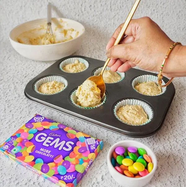 Lemon & Poppy Seeds Muffins with Gems - Spoon the batter into the muffin tin