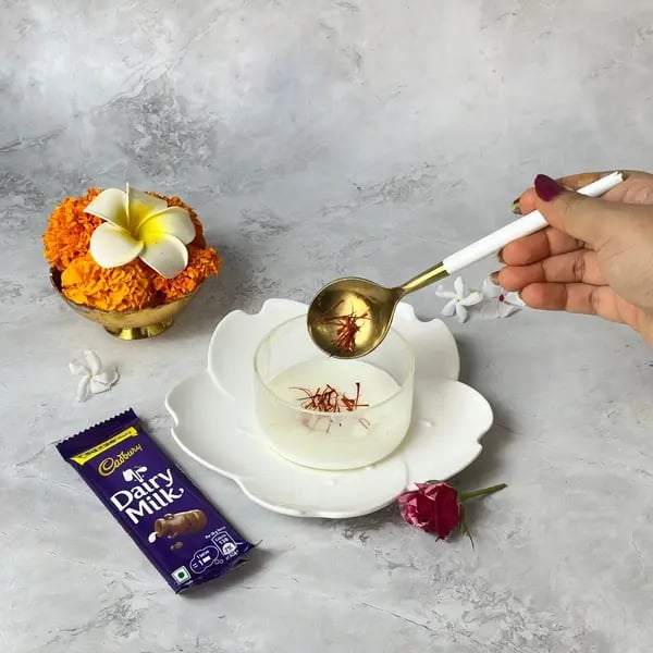 Make This Kesar Elaichi Shrikhand Recipe With Dairy Milk Fusion For Festive Flavors - Saffron Steeping In Milk
