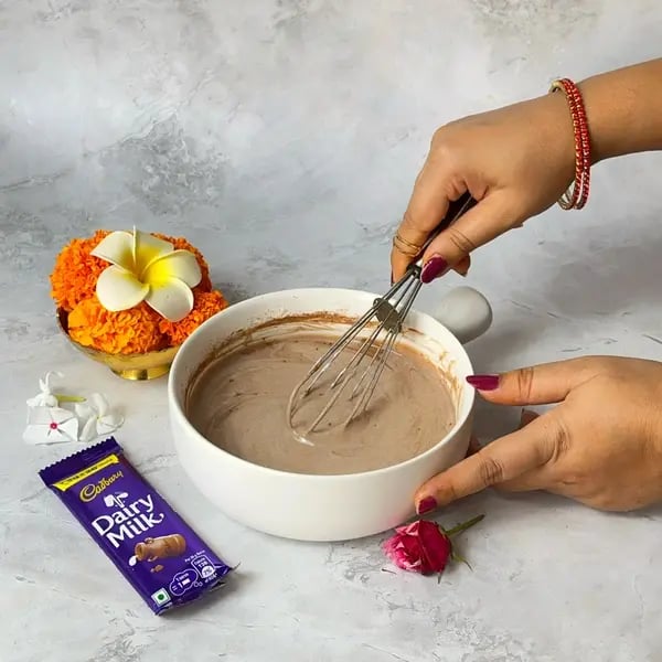 Make This Kesar Elaichi Shrikhand Recipe With Dairy Milk Fusion For Festive Flavors - Mixing Ingredients Thoroughly
