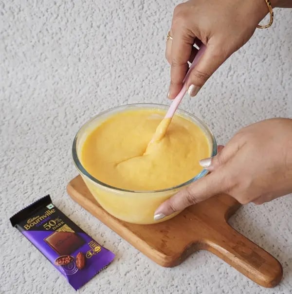 Mango Mousse with Dark Chocolate Crunch - Fold gently using a spatula